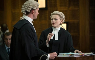 why do british lawyers wear wigs